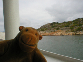 Mr Monkey looking at ferries and boats around Saltholmen