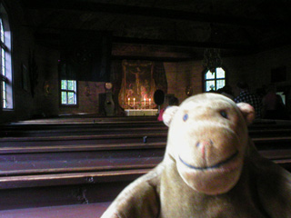 Mr Monkey in the pews of the Seglora church