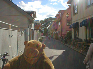 Mr Monkey walking down Stora Gatan in Sigtuna