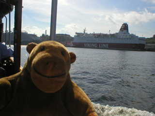 Mr Monkey looking across at a Viking Line ferry