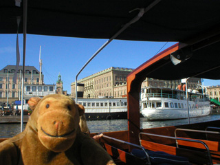 Mr Monkey passing ships in front of the Royal Palace