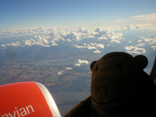 Mr Monkey looking down at Sweden from his plane