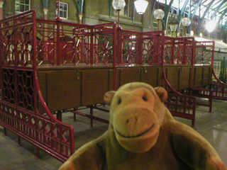 Mr Monkey looking at closed market stalls in Covent Garden