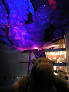 Mr Monkey beneath a strange giant metal globe