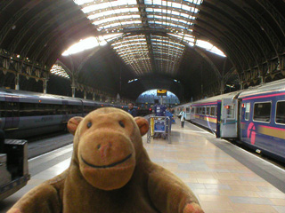 Mr Monkey on a platform at Paddington