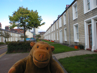 Mr Monkey looking at a street of railway workers houses