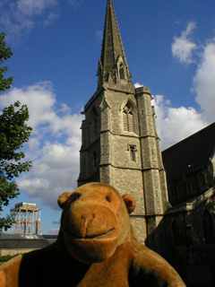 Mr Monkey looking at the tower of St Mark's church
