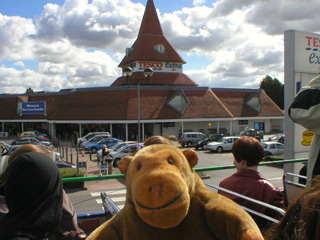Mr Monkey outside Tesco, the site of St Zvlkx's cathedral