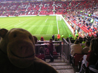 Mr Monkey trying to see the Red Devil mascot leave the pitch