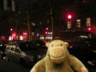 Mr Monkey looking at red streetlights
