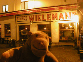 Mr Monkey outside a small restaurant