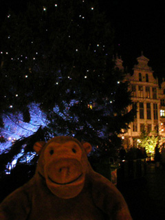 Mr Monkey beside a Christmas tree in the Grand Place