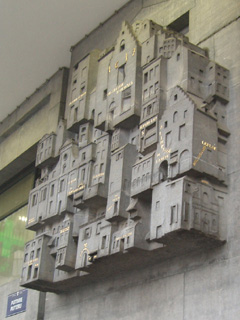 A sculpture showing the buildings demolished to build the station