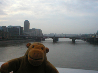Mr Monkey looking at Blackfriars Bridge from the Millennium Bridge