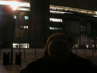 Mr Monkey outside the Tate Modern in the dark