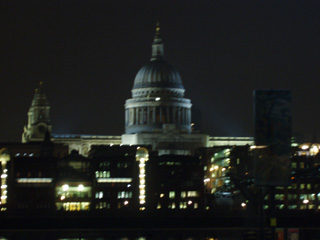 The dome of St Pauls lit up at dusk