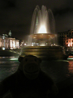 Mr Monkey in front of one of the Trafalgar Square fountains