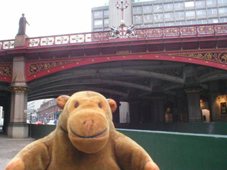 Mr Monkey looking up at Holborn Viaduct from Farringdon Road