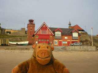 Mr Monkey looking at Cullercoats lifeboat station