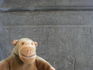 Mr Monkey looking at the sarcophagus of Nectanebo II