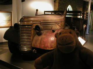 Mr Monkey with a wrecked Chevrolet truck