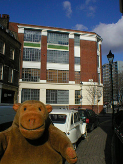 Mr Monkey looking at an old Ingersoll watch factory