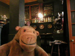 Mr Monkey looking at the bar of the Jerusalem Tavern