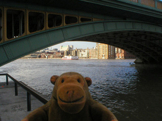 Mr Monkey looking under Southwark Bridge