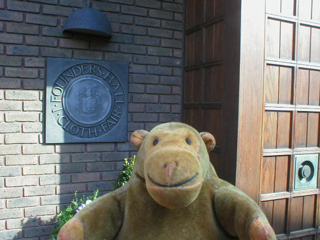 Mr Monkey outside the door of Founders Hall