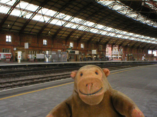 Mr Monkey looking across the tracks at Bristol station