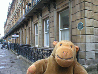 Mr Monkey looking at a house that W.G. Grace once lived in