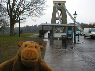 Mr Monkey looking towards the tollbooth in front of the bridge