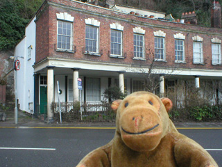 Mr Monkey looking at shops and lodgings near the old spa springs