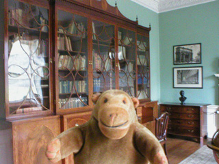Mr Monkey in the library of the Georgian House
