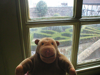 Mr Monkey looking out of the parlour window