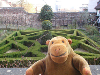 Mr Monkey looking over the garden of the Red Lodge