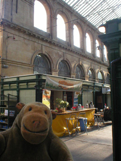 Mr Monkey looking at open stalls in St Nicholas market
