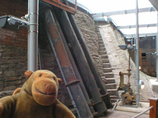 Mr Monkey looking at walls of the dry dock