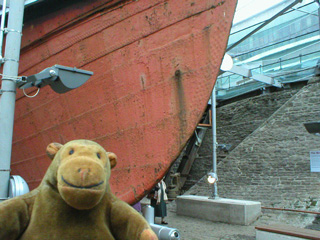 Mr Monkey looking at the prow of the S.S. Great Britain