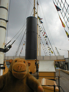 Mr Monkey looking at the replica funnel aboard the Great Britain