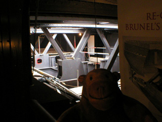 Mr Monkey looking into the engine room of the Great Britain