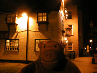 Mr Monkey looking at the Hole In The Wall pub
