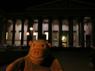 Mr Monkey outside the British Museum in the dark