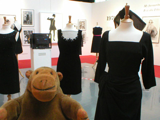 Mr Monkey looking at dresses from the fifties