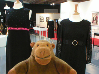 Mr Monkey looking at dresses from the sixties