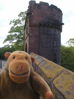 Mr Monkey approaching a semi-circular wall tower
