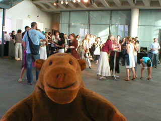 Mr Monkey watching people drinking their free cocktails