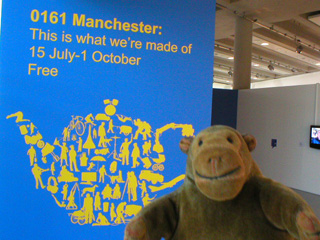Mr Monkey following the signs to the exhibition