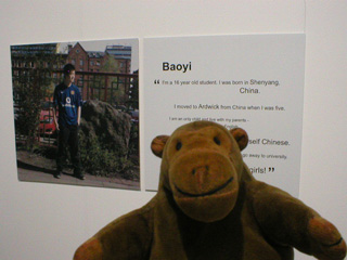 Mr Monkey looking at a photo and an interview