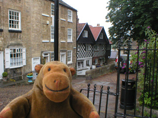 Mr Monkey looking at a street in Knaresborough